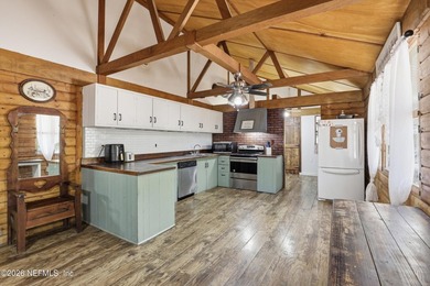 Adorable home with rustic farmhouse flair nestled on just over - photo 13