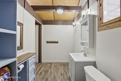 Adorable home with rustic farmhouse flair nestled on just over - photo 21