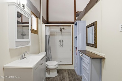 Adorable home with rustic farmhouse flair nestled on just over - photo 22