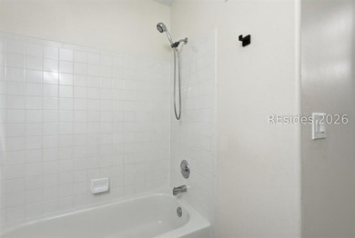 Extensively renovated in 2023, this second-floor end unit offers - photo 39