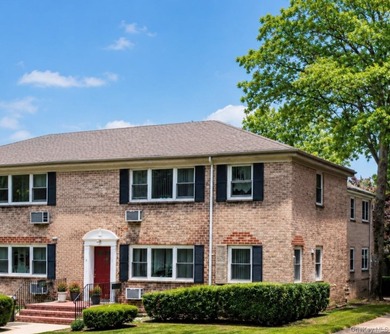 Welcome home to this sun-filled second-floor CORNER unit in a - photo 2