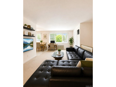Welcome home to this sun-filled second-floor CORNER unit in a - photo 4