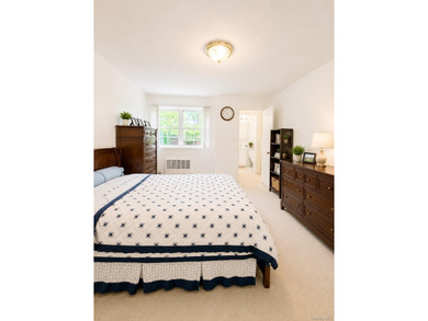 Welcome home to this sun-filled second-floor CORNER unit in a - photo 7