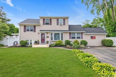 Spacious East Islip Split-Level Home! This well-maintained - photo 1