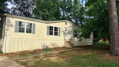 Spacious 4-bedroom, 2-bathroom mobile home nestled on a - photo 1
