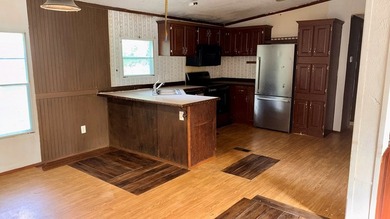Spacious 4-bedroom, 2-bathroom mobile home nestled on a - photo 6