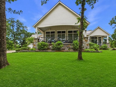 Nestled among towering hardwoods in the gated waterfront - photo 2