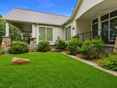 Nestled among towering hardwoods in the gated waterfront - photo 3