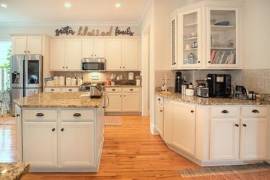 Welcome to this beautifully elevated Lowcountry-style home--the - photo 7