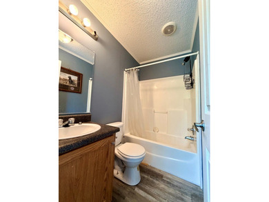Set on a full acre in the desirable Laguna Shores subdivision on - photo 8