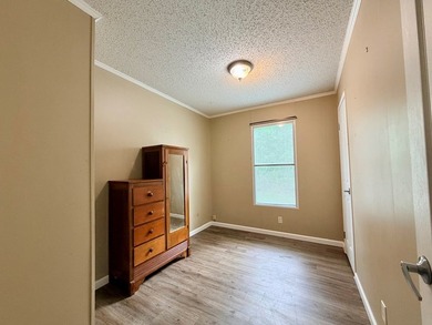 Set on a full acre in the desirable Laguna Shores subdivision on - photo 9
