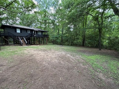 Private East Texas retreat nestled among the trees on 1.24 - photo 2