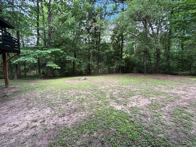 Private East Texas retreat nestled among the trees on 1.24 - photo 8