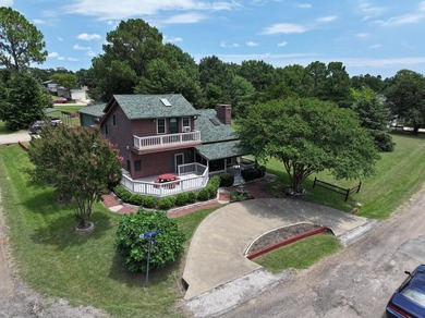 BEAUTIFULLY LANDSCAPED HOME ON 4 LOTS AT THE HEART OF THE LAKE - photo 1