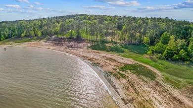 Discover 4.5 acres of cleared waterfront on the shores of Lake - photo 1