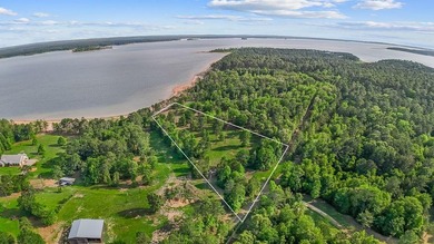 Discover 4.5 acres of cleared waterfront on the shores of Lake - photo 4