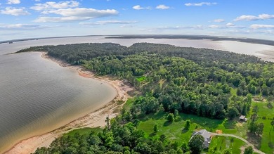 Discover 4.5 acres of cleared waterfront on the shores of Lake - photo 9