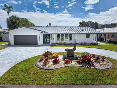 Experience waterfront living in this beautifully updated - photo 2