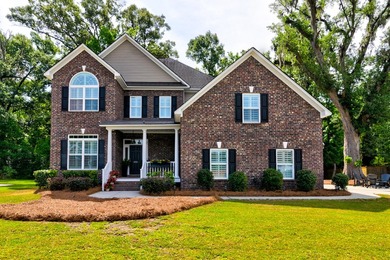 This beautiful brick, two-story home in Cedar Grove sits on a - photo 1