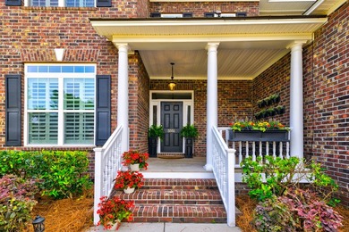 This beautiful brick, two-story home in Cedar Grove sits on a - photo 2
