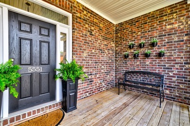 This beautiful brick, two-story home in Cedar Grove sits on a - photo 3