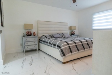 Move-in ready 4-bedroom, 3-bath home in desirable NW Cape Coral! - photo 8