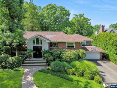 New Price Offering! Nestled on a quiet, tree-lined street, this - photo 1