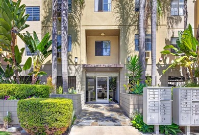 Welcome to this unique top-floor corner unit in the vibrant - photo 3