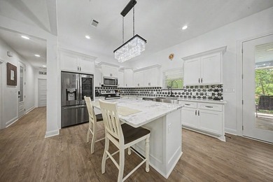 Beautifully designed 3-bedroom, 2.5-bath home backing up to the - photo 8