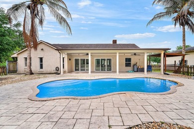 Set on a beautifully manicured and fenced 1.15-acre lot, this - photo 5
