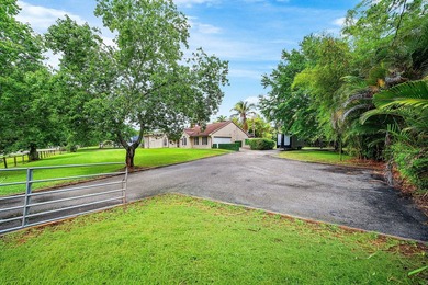 Set on a beautifully manicured and fenced 1.15-acre lot, this - photo 7