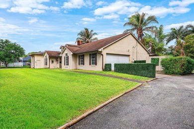 Set on a beautifully manicured and fenced 1.15-acre lot, this - photo 8