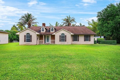 Set on a beautifully manicured and fenced 1.15-acre lot, this - photo 9