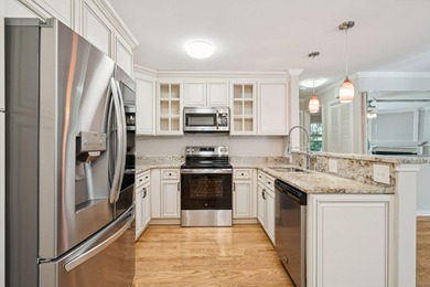 This first floor condo in a gated community with tons of - photo 2