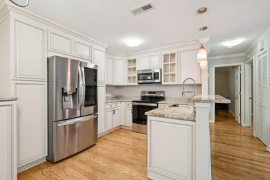 This first floor condo in a gated community with tons of - photo 3