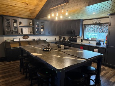 This stunning 3-bedroom, 2-bathroom lakefront retreat is the - photo 3