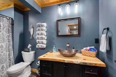 This stunning 3-bedroom, 2-bathroom lakefront retreat is the - photo 9