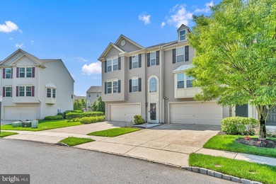 Welcome to this beautifully maintained end-unit townhome in the - photo 1