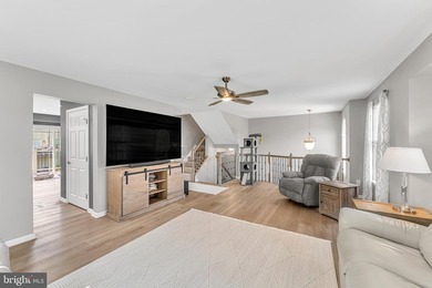 Welcome to this beautifully maintained end-unit townhome in the - photo 2