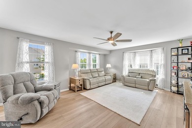 Welcome to this beautifully maintained end-unit townhome in the - photo 3