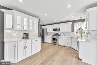 Welcome to this beautifully maintained end-unit townhome in the - photo 5