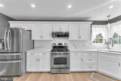 Welcome to this beautifully maintained end-unit townhome in the - photo 7