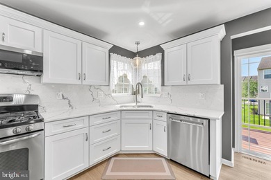 Welcome to this beautifully maintained end-unit townhome in the - photo 8