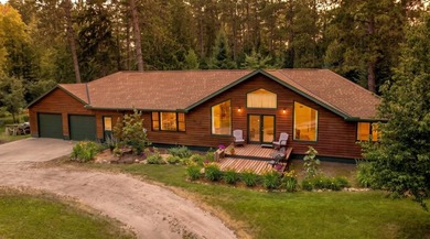 Towering mature pine trees on 5 private acres, this beautiful