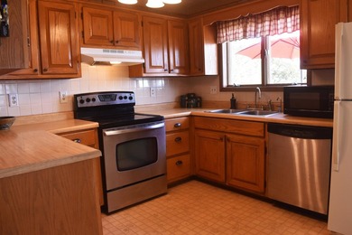 Enjoy lakeside living in this 3-bedroom, 2.5-bathroom brick home - photo 13