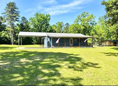 Charming 2-bedroom, 2-bath home on 1.55 unrestricted acres near - photo 1