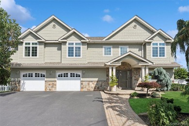 Experience exceptional waterfront living in this stunning - photo 1