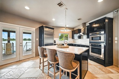 Experience elevated lakefront living in this beautifully - photo 6
