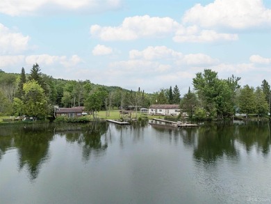 This charming four-unit resort on Lake Emily boasts 2,276 square - photo 2