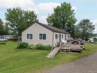 This charming four-unit resort on Lake Emily boasts 2,276 square - photo 4